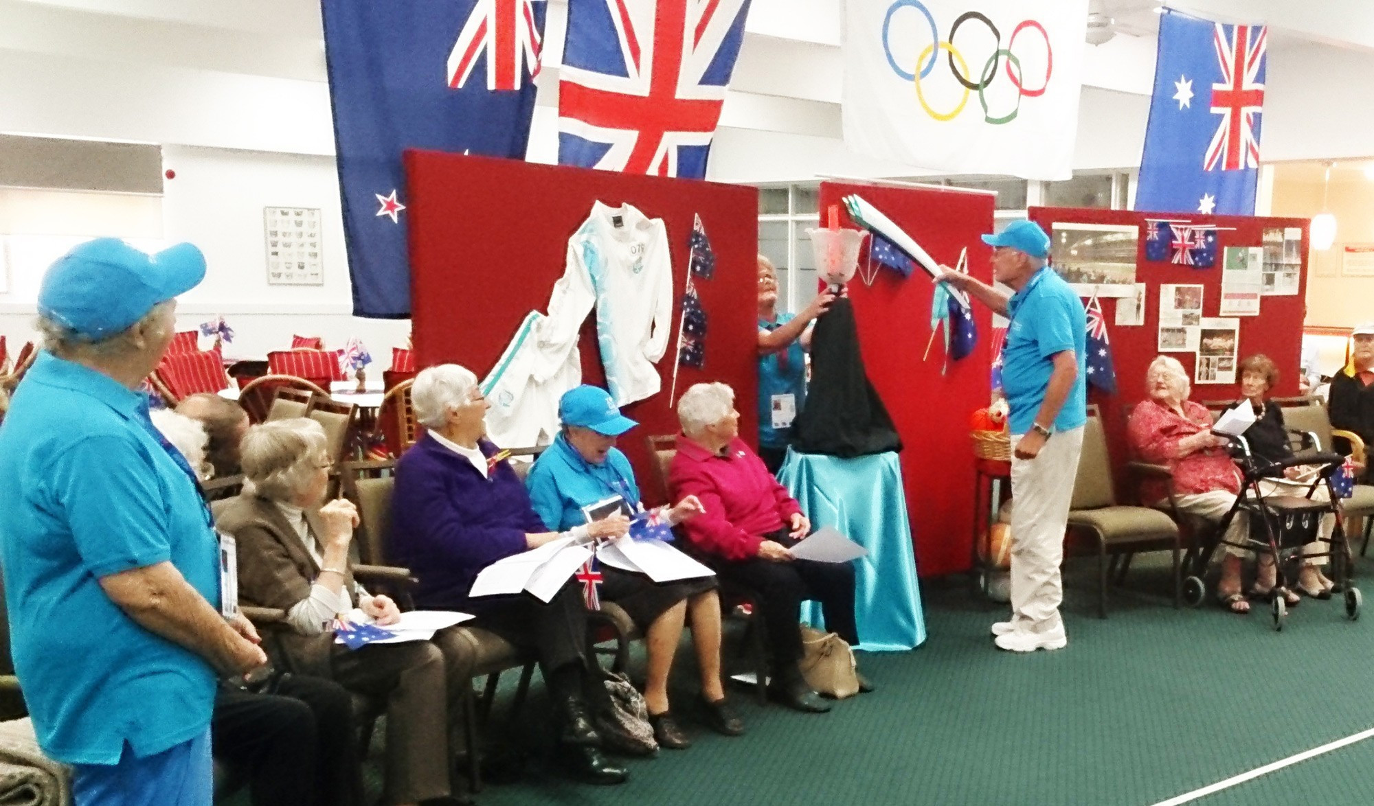 <p>Neil McCann lights the Olympic flame.</p>
