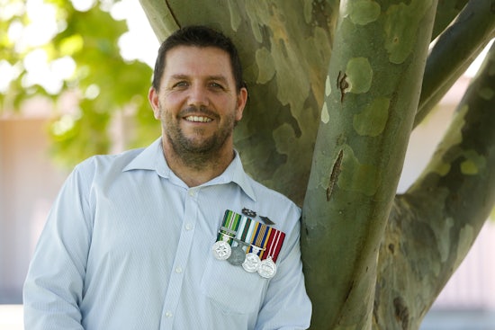<p>Retirement Living NSW/ACT Manager of the Year 2015 Award winner Mark Surace, pictured with medals from his former Australian Defence Force career.</p>
