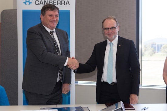 <p>Vice-Chancellor Professor Stephen Parker and Moran Health managing director Peter Moran sign an agreement to build an aged care facility on campus.</p>
