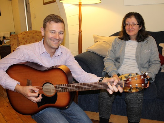 <p>Tim Windsor leads a volunteer music group with Swan Cottage resident Marie Elsegood.</p>
