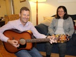 Tim Windsor leads a volunteer music group with Swan Cottage resident Marie Elsegood.