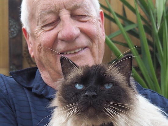 <p>Senior John Foote and Ollie the rescue cat who found each other through the Shy Cats and Senior Citizens Program (Source: PetRescue)</p>
