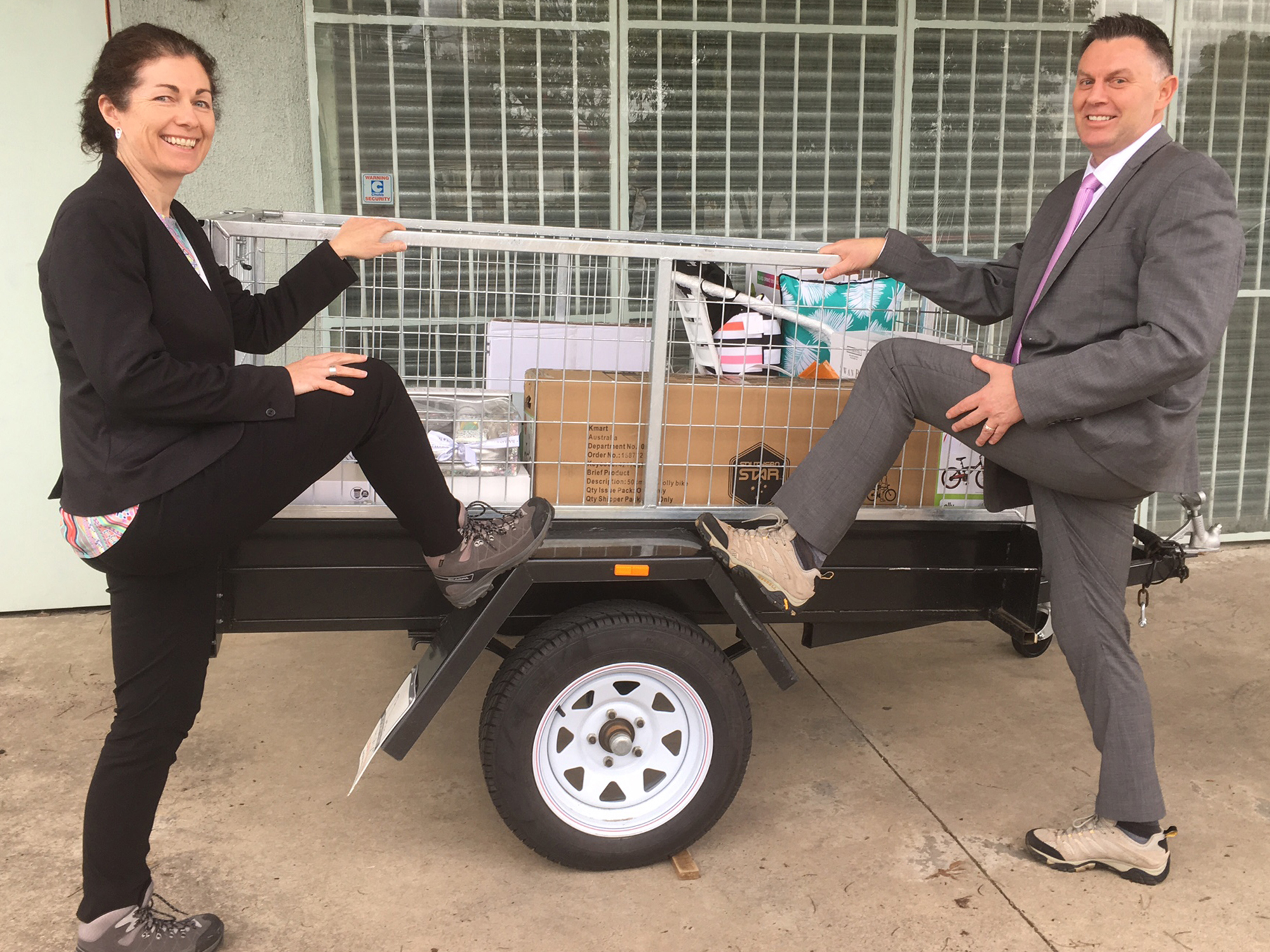 <p>James van Beek and Sarah Pettenon with their boots and trailer, which is being raffled as part of fundraising efforts (Source: Lifeview Residential Care)</p>
