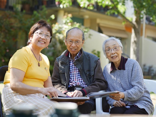 <p>Villa Maria Catholic Homes Case Manager and translator Amy Yuen with Yin Chen and his wife [Source: VMCH]</p>
