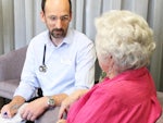 Specilaist palliative care nurse practitioner Peter Jenkin with a patient