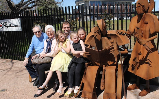 <p>Artist Gerry McMahon with his parents and daughters alongside the sculpture</p>

