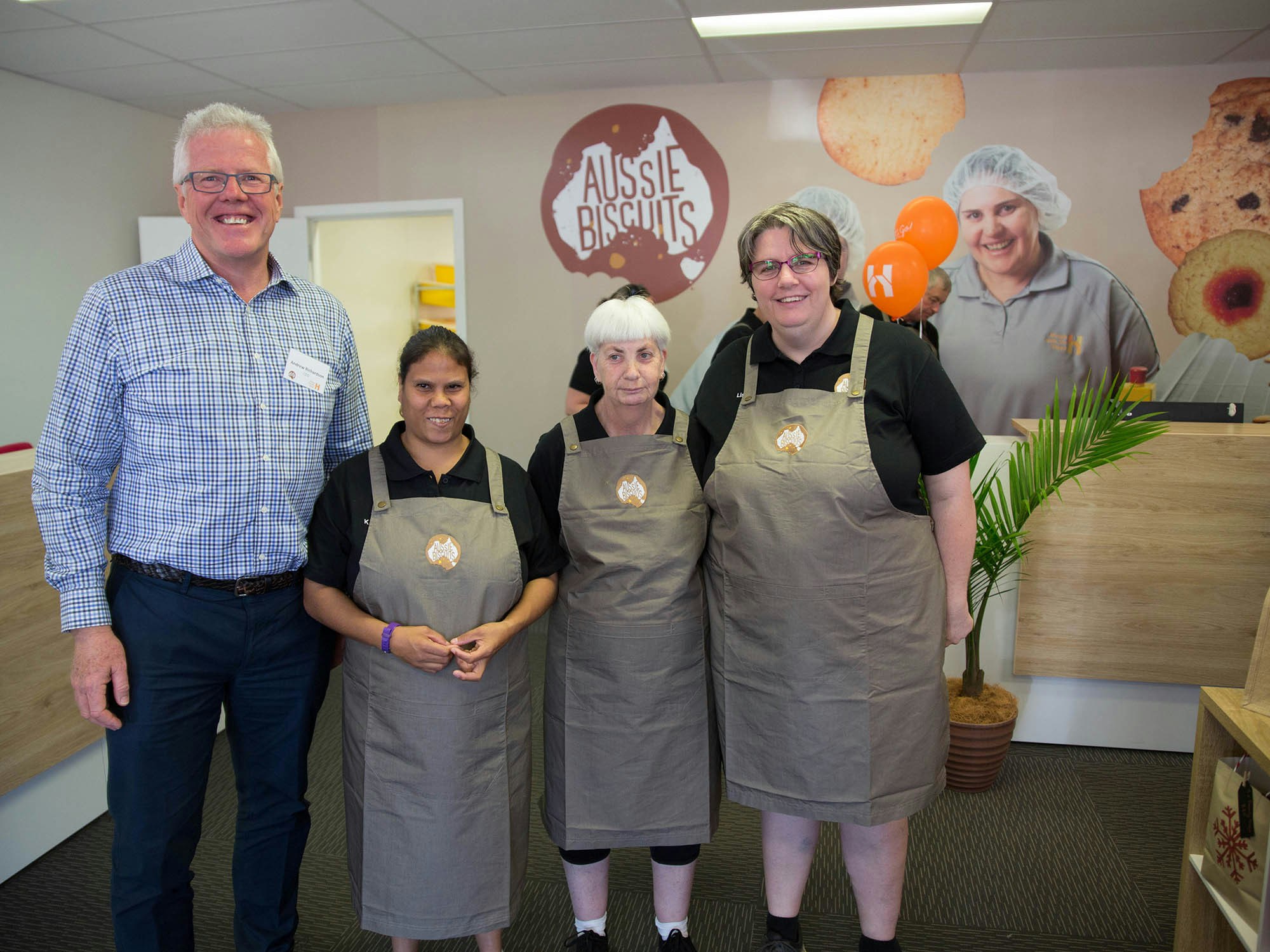 Brett Lacey with Aussie Biscuits&#8217; supported employees [Source: House with No Steps]
