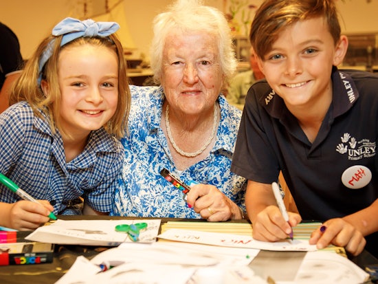 <p>Unley Primary School students Zara Rodda (L) and Matthew Morrell (R) with ECH client Marie Jones (centre) (Source: City of Unley)</p>
