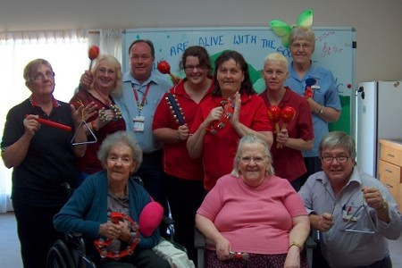 <p>Residents and staff with musical instruments</p>
