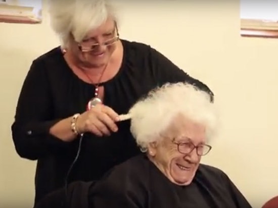 <p>Doris Thackery shaving her head for cancer, a day after her 99th birthday</p>
