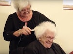 Doris Thackery shaving her head for cancer, a day after her 99th birthday