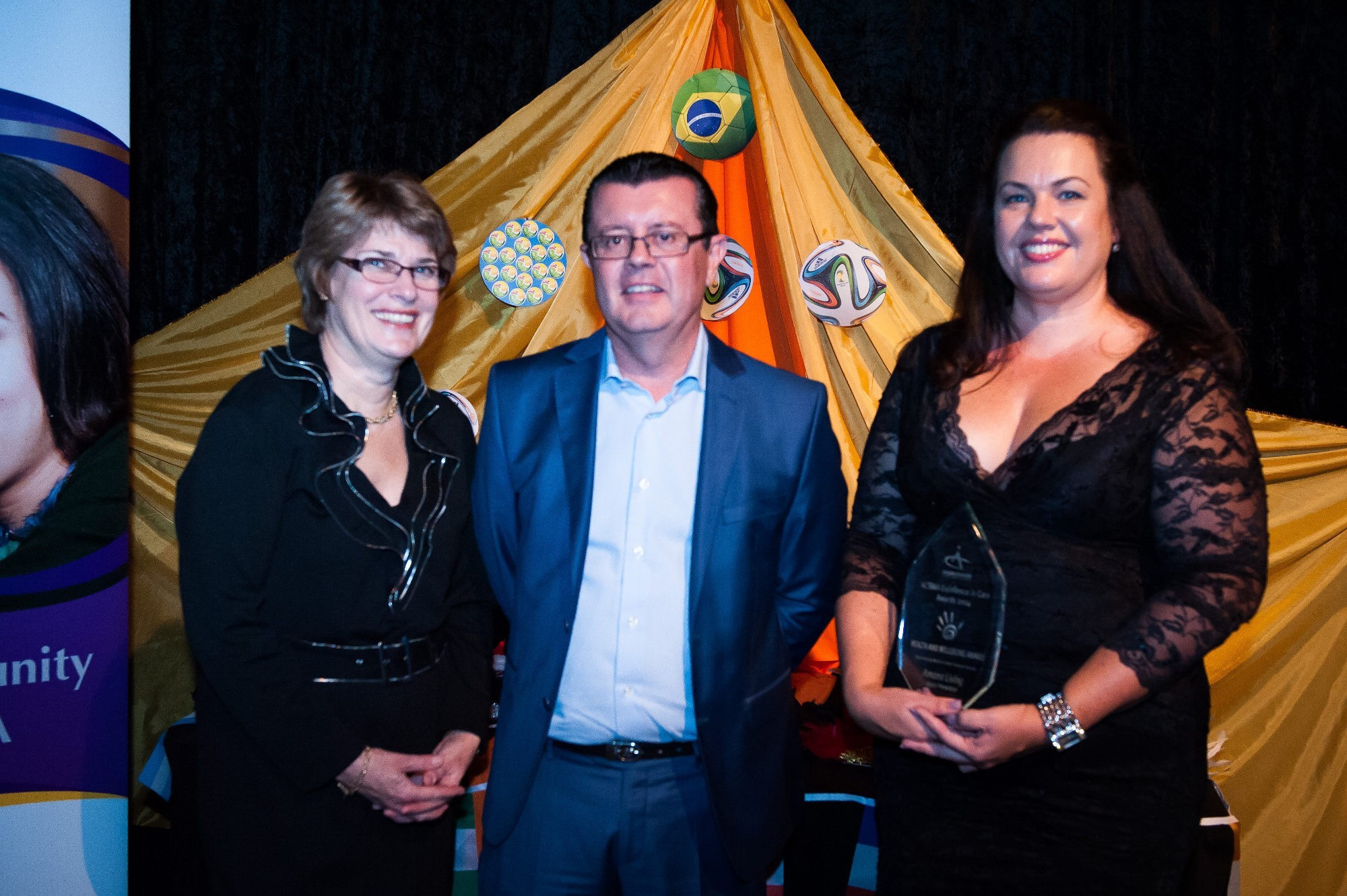 <p>Angela Summers (left) and Jenny Williams, of Amana Living, accept the ACSWA Health and Wellbeing Award, sponsored by Brett Waterman (centre) of Western United Financial Services.</p>
