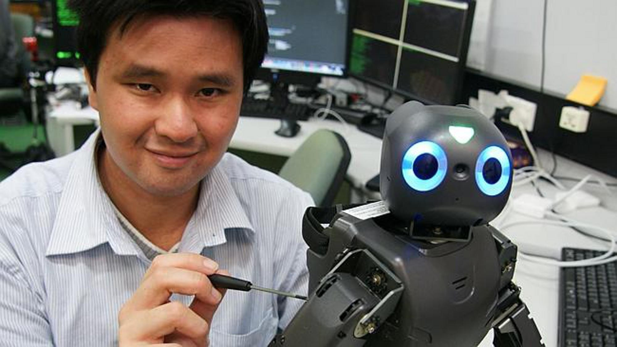 <p>Project leader, Aaron Wong, with the humanoid robot named DARwIn-OP.</p>
