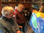 ACH Group customer, John Butters, and 10 year old, Ashley Pincott, have bonded over their love for surfing and painting.