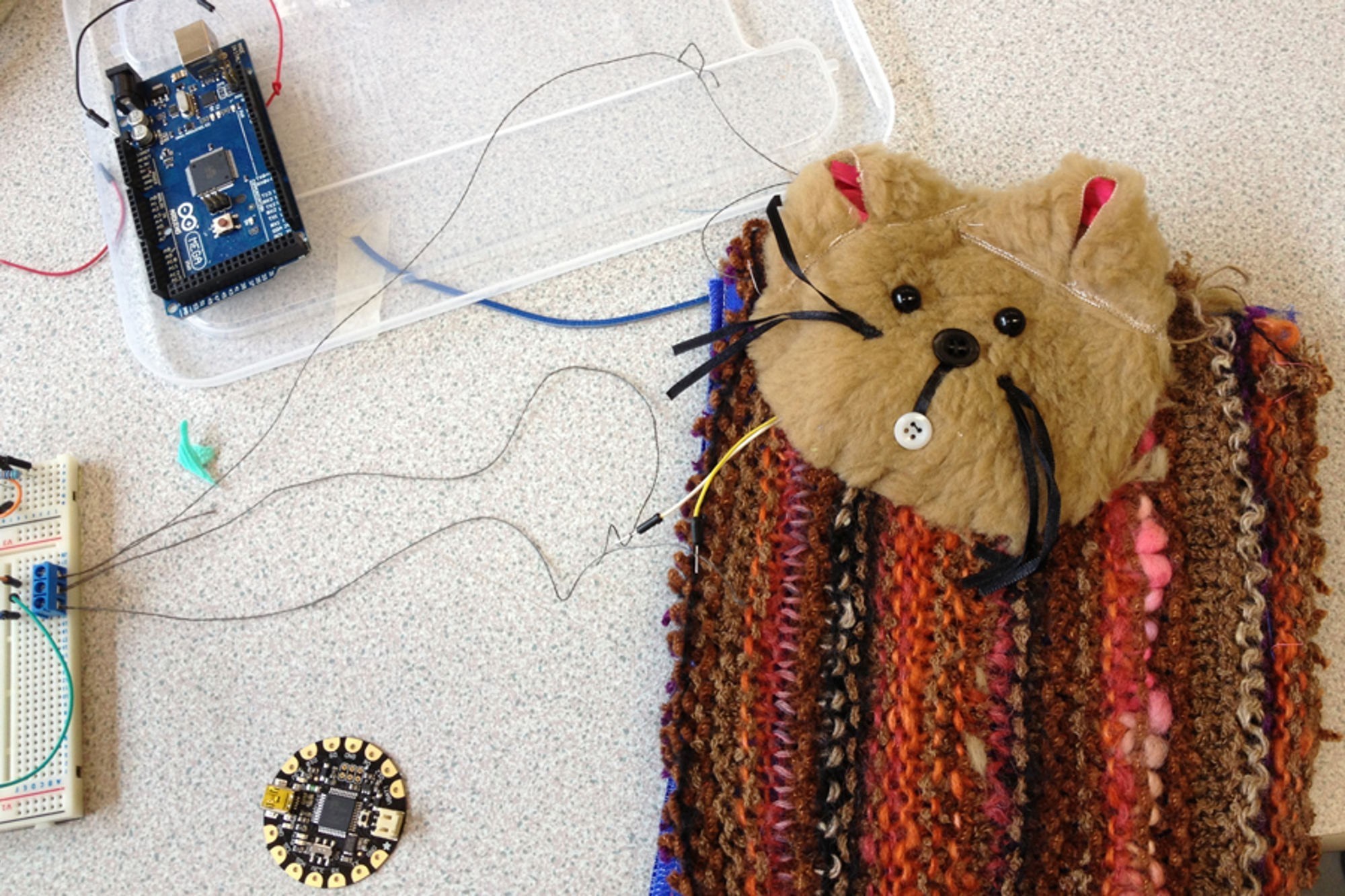 <p>The 'Cat Pocket' is a textile with embedded electronics which vibrates when stroked and is reminiscent of a purring cat.</p>
