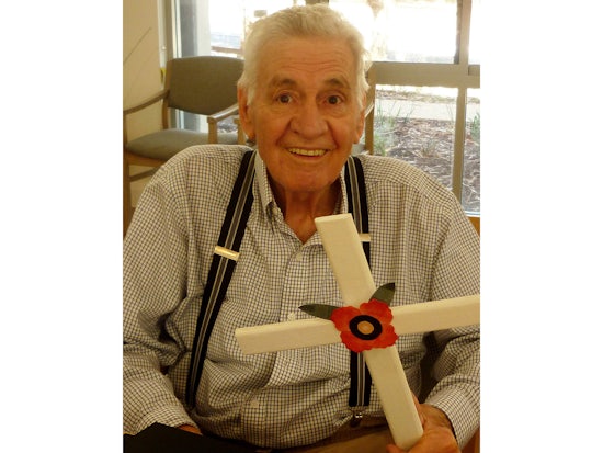 <p> Resthaven Aberfoyle Park resident, Mr Barry Burke, with his decorated cross for ANZAC Day. [Source: Resthaven].</p>
