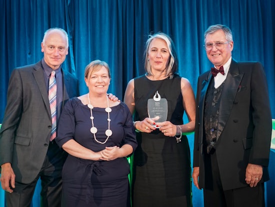 <p>Dementia Australia’s Dr Petrovich accepting the award for their EDIE initiative at the ITAC Conference on the Gold Coast (Source: Richard O’Leary)</p>
