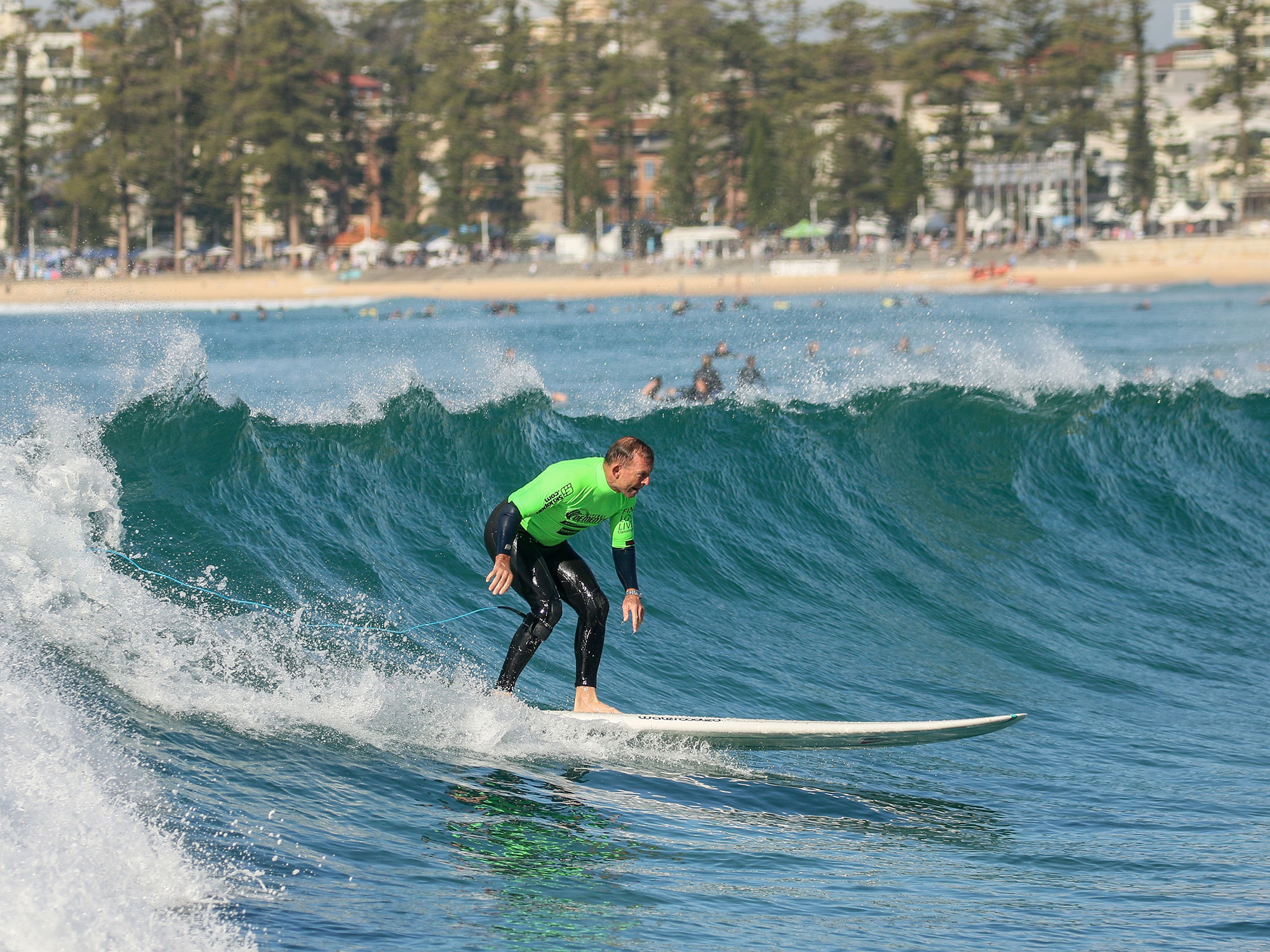 <p>Tony Abbott hits the surf (source: centre for healthy brain ageing)</p>
