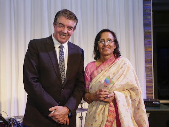 <p>Minister for Multiculturalism Ray Williams presents the award to Editor of Indian Down Under Neena Badhwar (Source: Multicultural NSW)</p>
