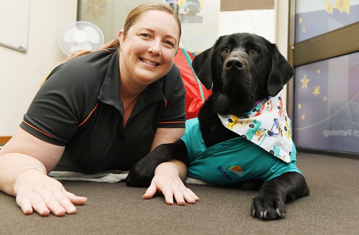 Dog-assisted therapy uses highly trained labradors, like Grady, to help children achieve their therapy goals. [Source: Kites Children&#8217;s Therapy]
