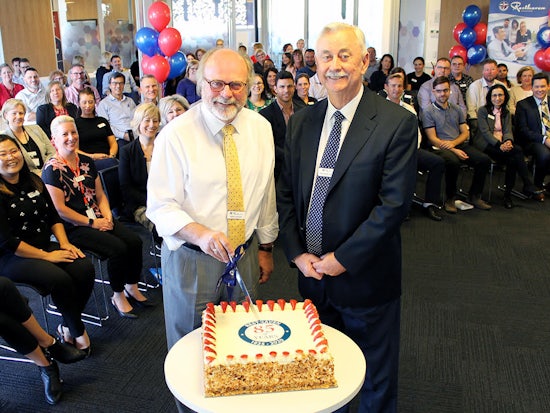 <p>President of the Resthaven Board, Mark Porter, with retiring Chief Executive Officer of Resthaven, Richard Hearn, cutting the cake at Resthaven’s 85th anniversary celebrations. [Source: Resthaven]</p>

