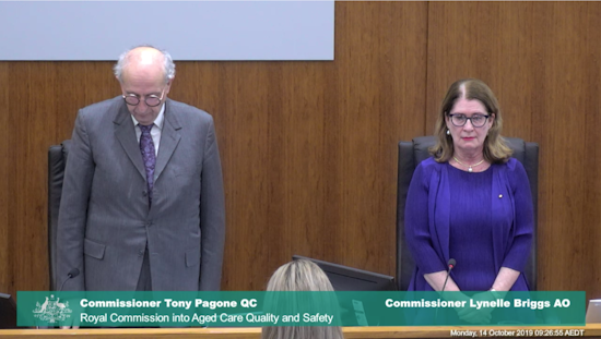 <p>The Royal Commissioners, Tony Pagone QC and Lynelle Briggs AO, and the court stood for a minute of silence in honour of Commissioner Richard Tracey. [Source: Aged Care Royal Commission]</p>
