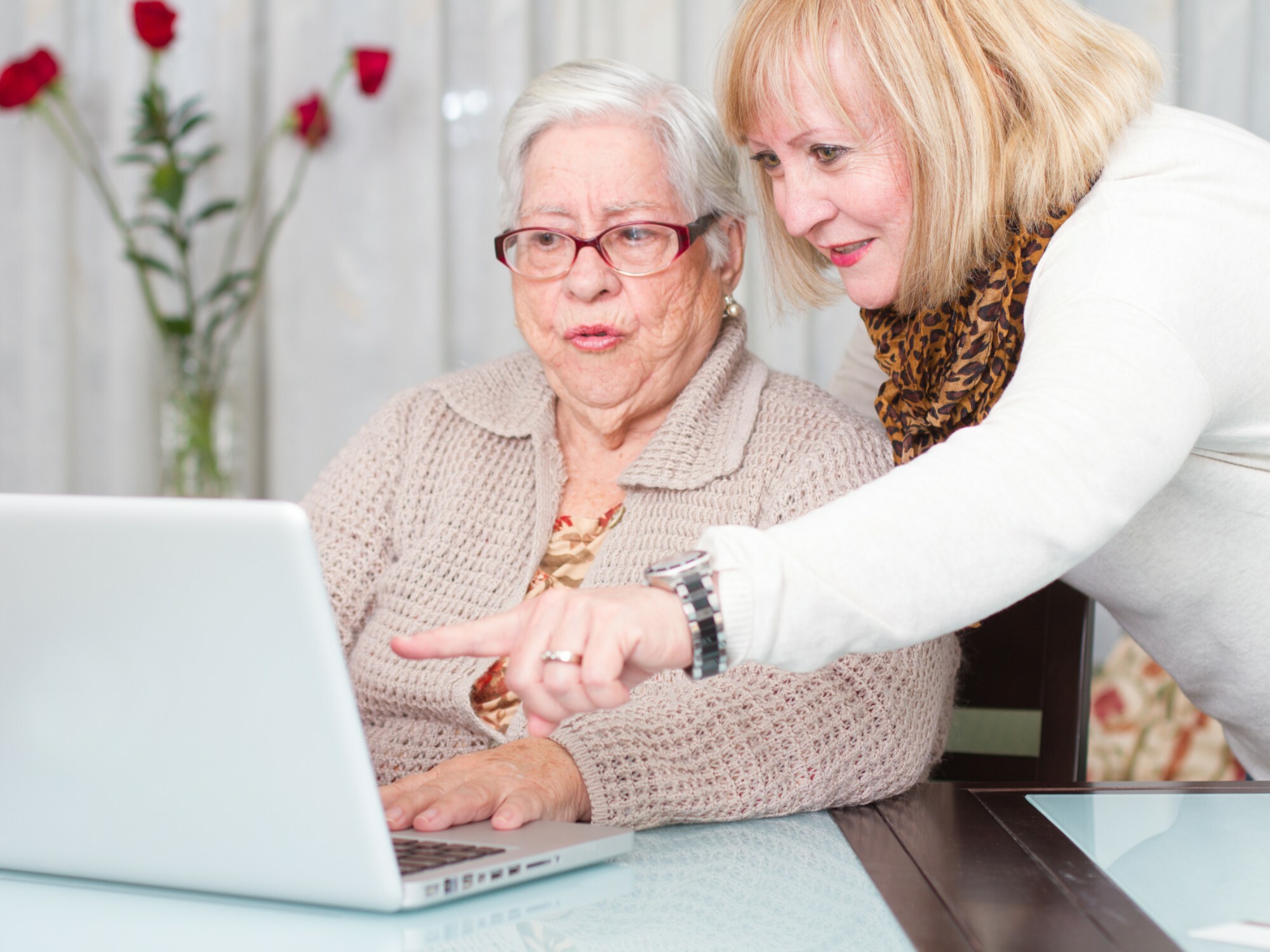 Older lady getting help from daughter
