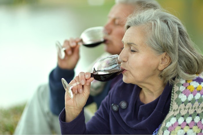 Extra services in aged care could include a glass of wine with dinner or other luxuries that make your stay more enjoyable. [Source: Shutterstock]
