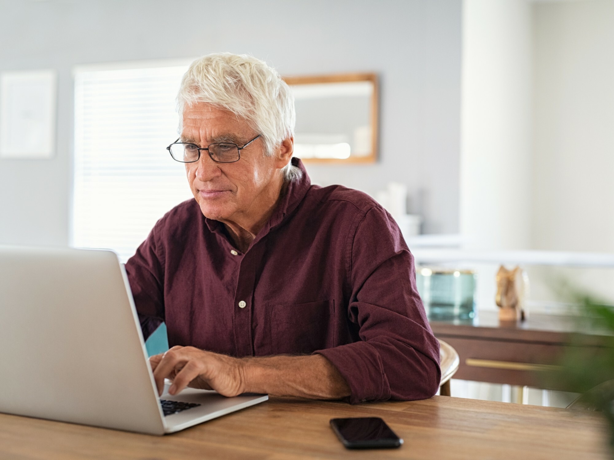 Man on his laptop searching the My Aged Care website