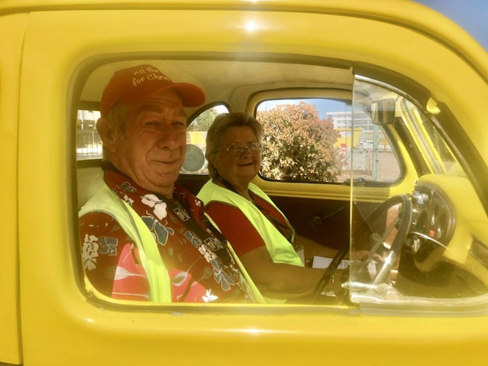 Jim and Grace Giles in their 1949 Ford Prefect Ute, which they use to deliver festive food on Christmas Eve for Meals on Wheels SA. [Source: Supplied]
