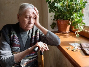 Older woman concerned over money.