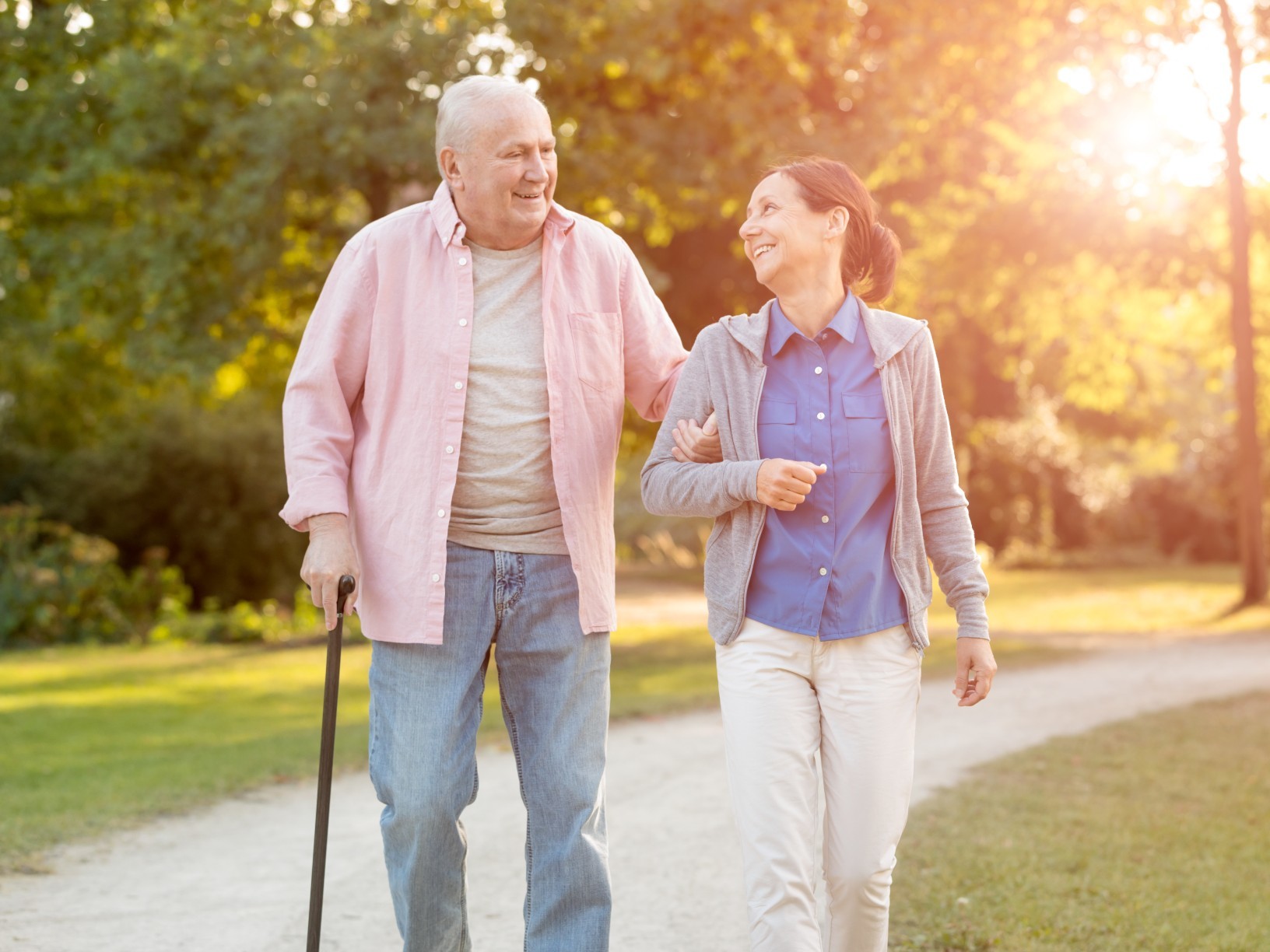 Older man receiving help from his carer