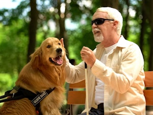 Older man with his guide dog