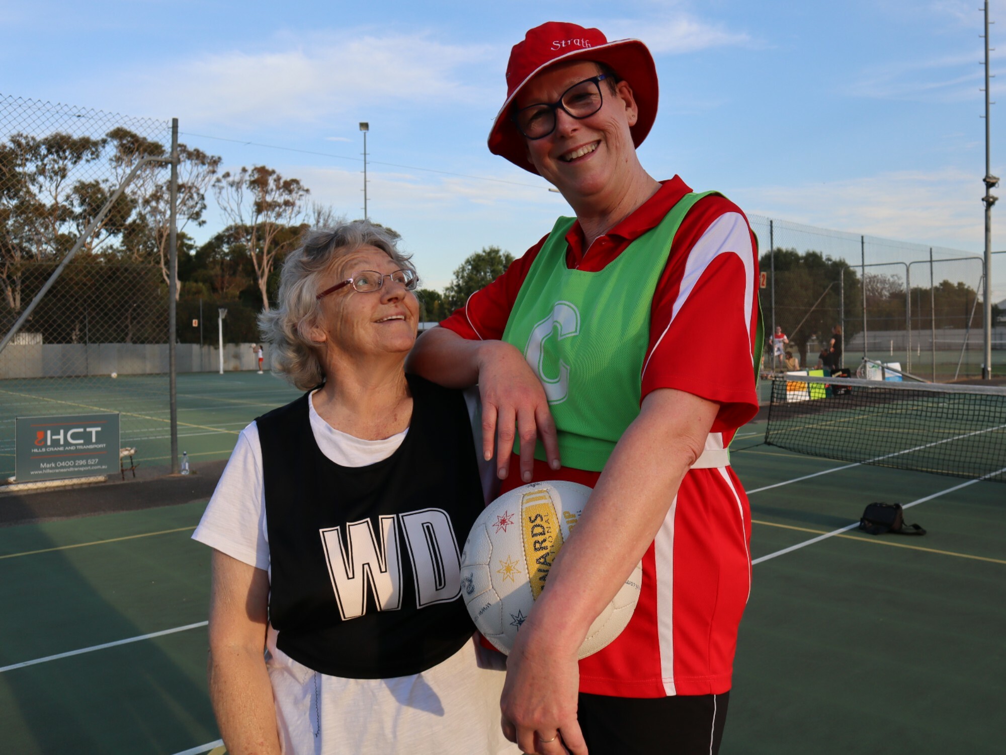 Strathalbyn walking netball team members, Sue and Amanda, love being back on the netball court. [Source: DPS]
