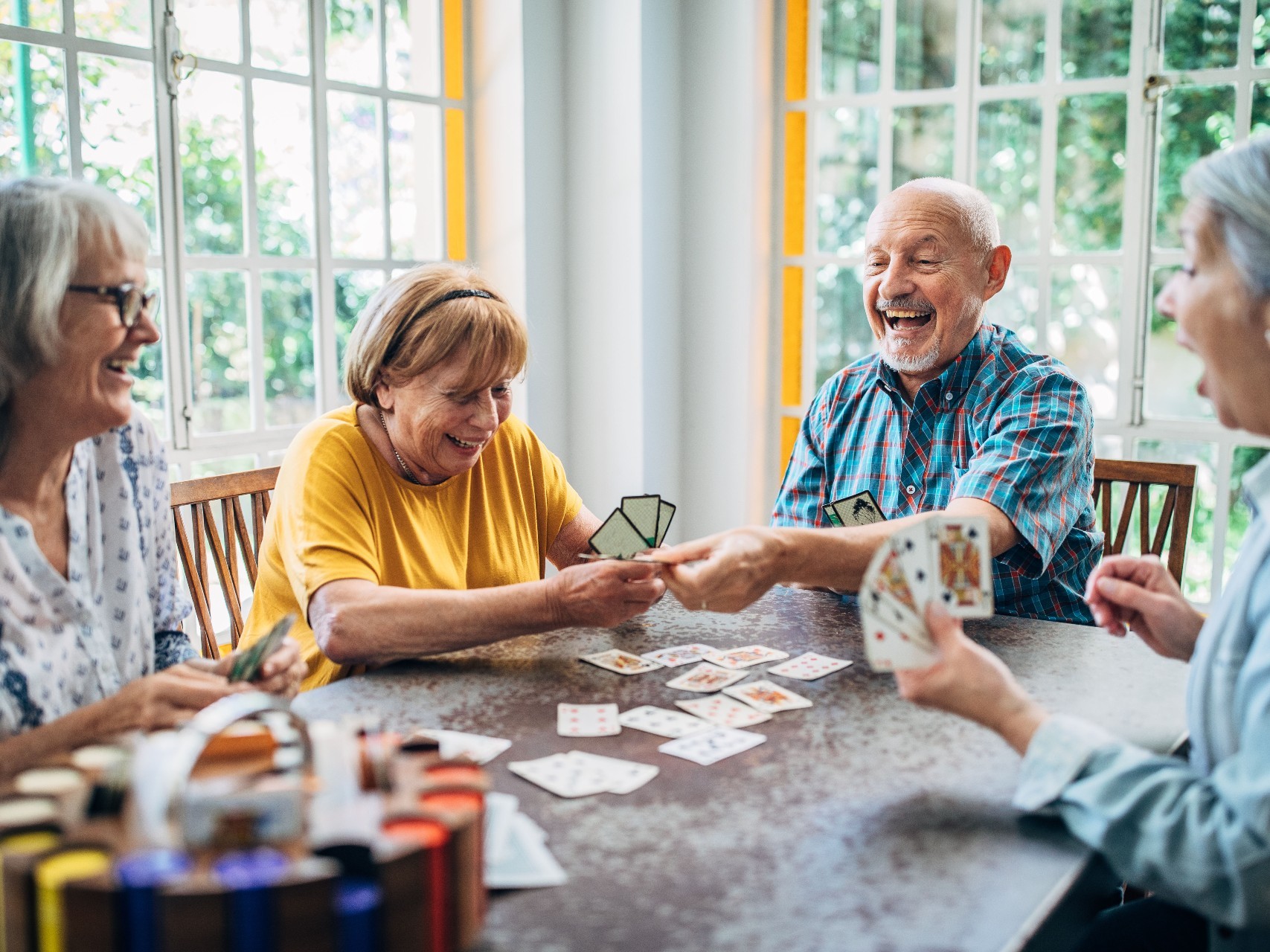 Group of retirees playing cards