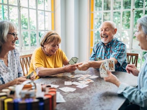 Group of retirees playing cards