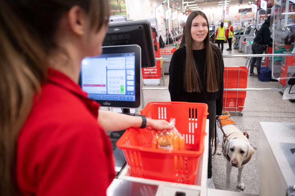 Blind woman shopping at Coles supermarket