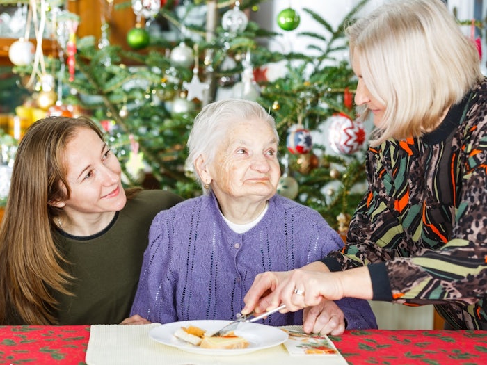 Guests should be aware that the older loved one with dementia still wants and enjoys conversation and laughter. [Source: iStock]
