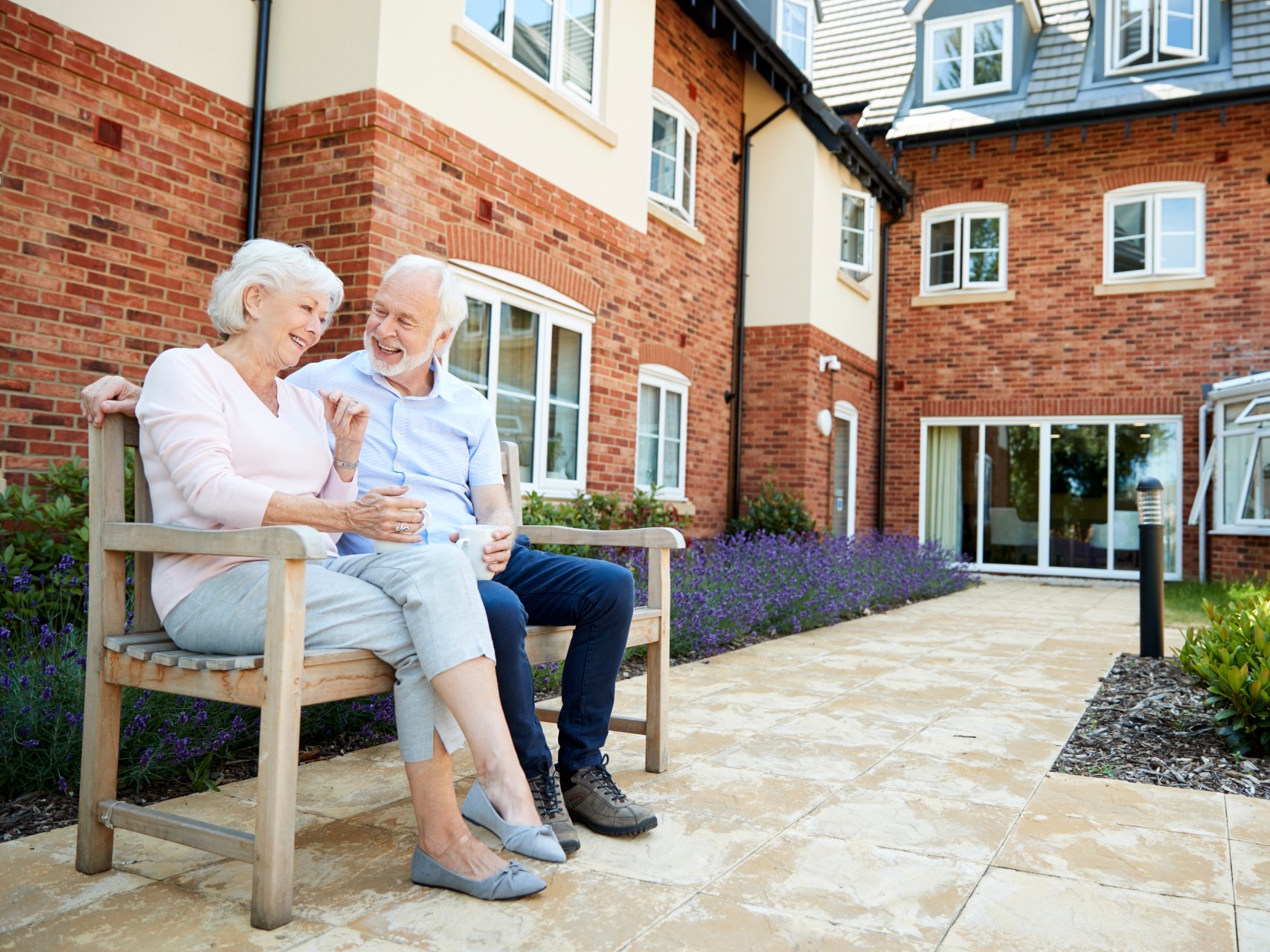Couple on a bench at their retirement village