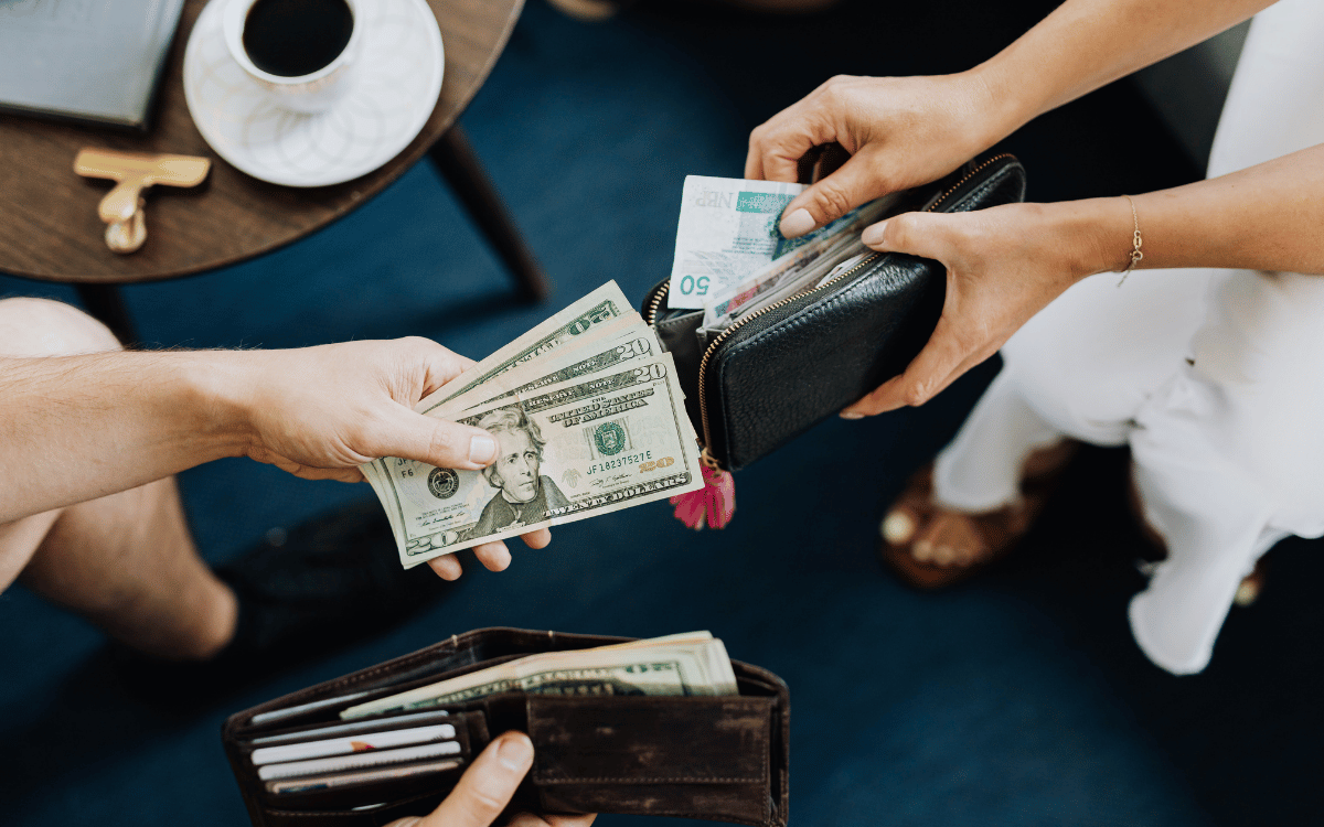 Two people exchanging money