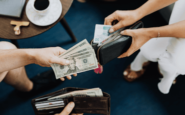 Two people exchanging money