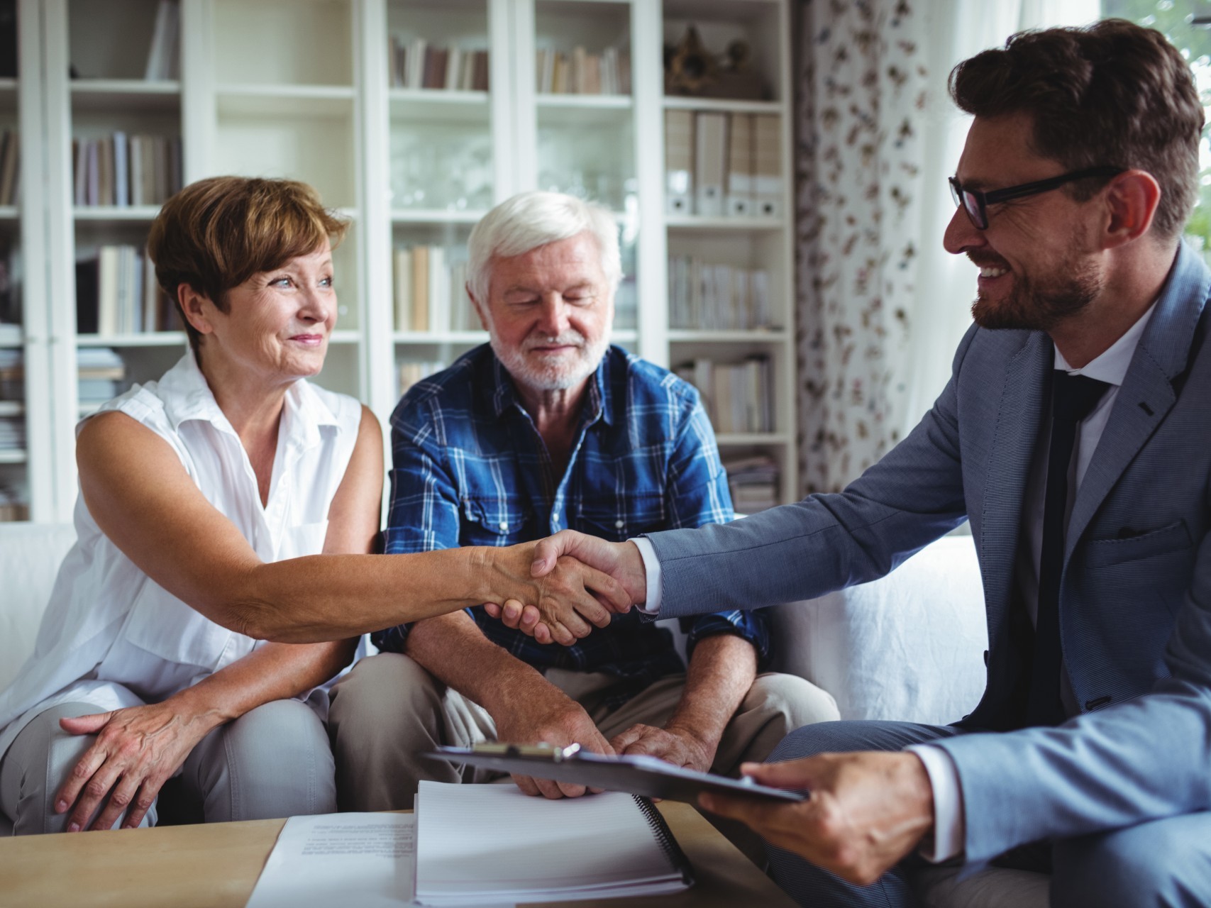 A couple talk to their provider about their home care agreement