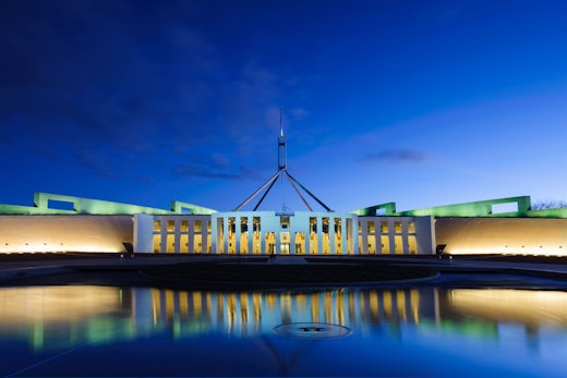 Blue light covers the parliament house in Canberra