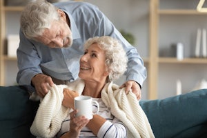 A man gives his wife a cup of tea