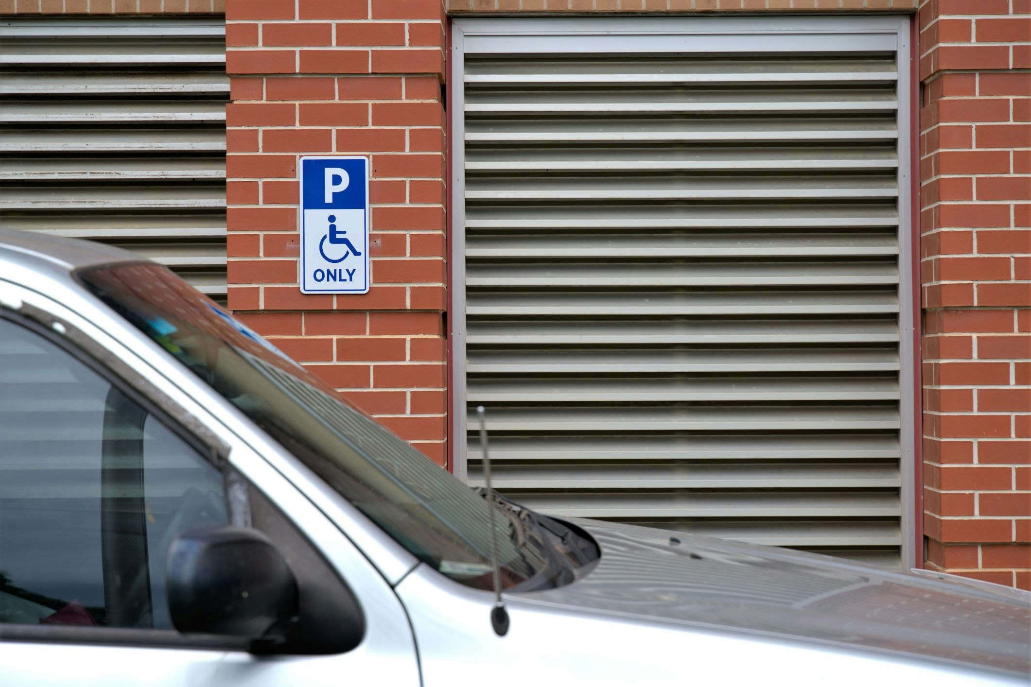 Disability parking space with international parking signage