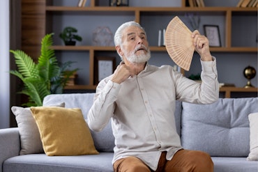 A man uses a fan