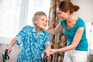 Older woman with a personal care assistant