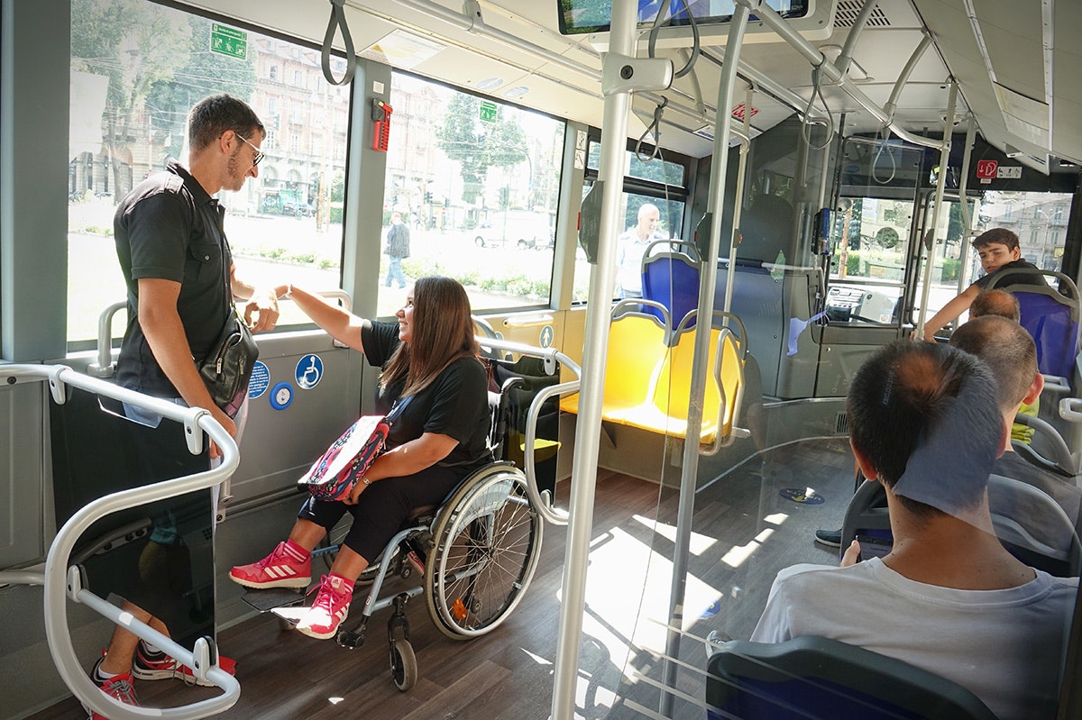 Lady in wheelchair using public transport [Source: Shutterstock]
