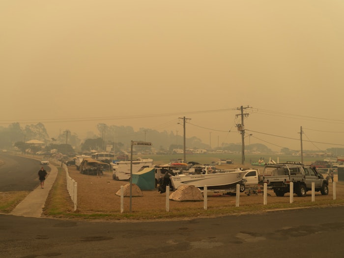 People in New South Wales evacuating from their homes during raging bushfires. [Source: Shutterstock]
