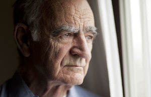 Older man looking out the window